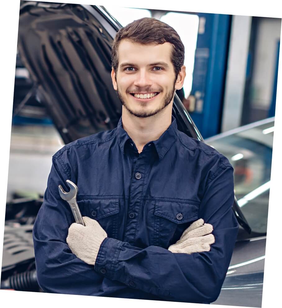 happy mechanic standing by car